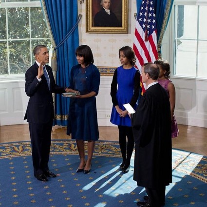 United States Supreme Court Chief Justice John Roberts administers the oath of office to President Barack Obama in the Blue Room of the White House on Inauguration Day